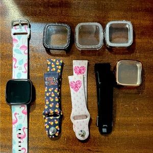 Fitbit Versa 2 with covers and bands. No scratches